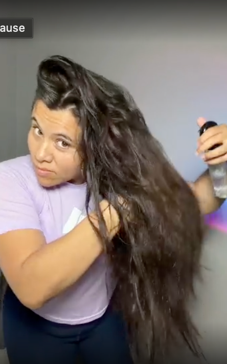 Customer showing long healthy-looking hair